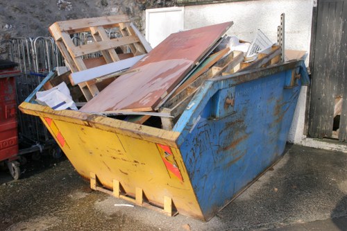 Homeowner decluttering their loft space