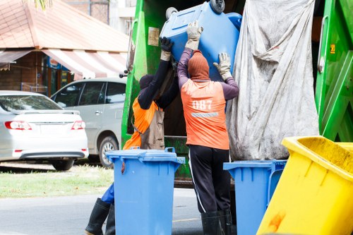Professional waste management team handling builders' debris in Hanwell